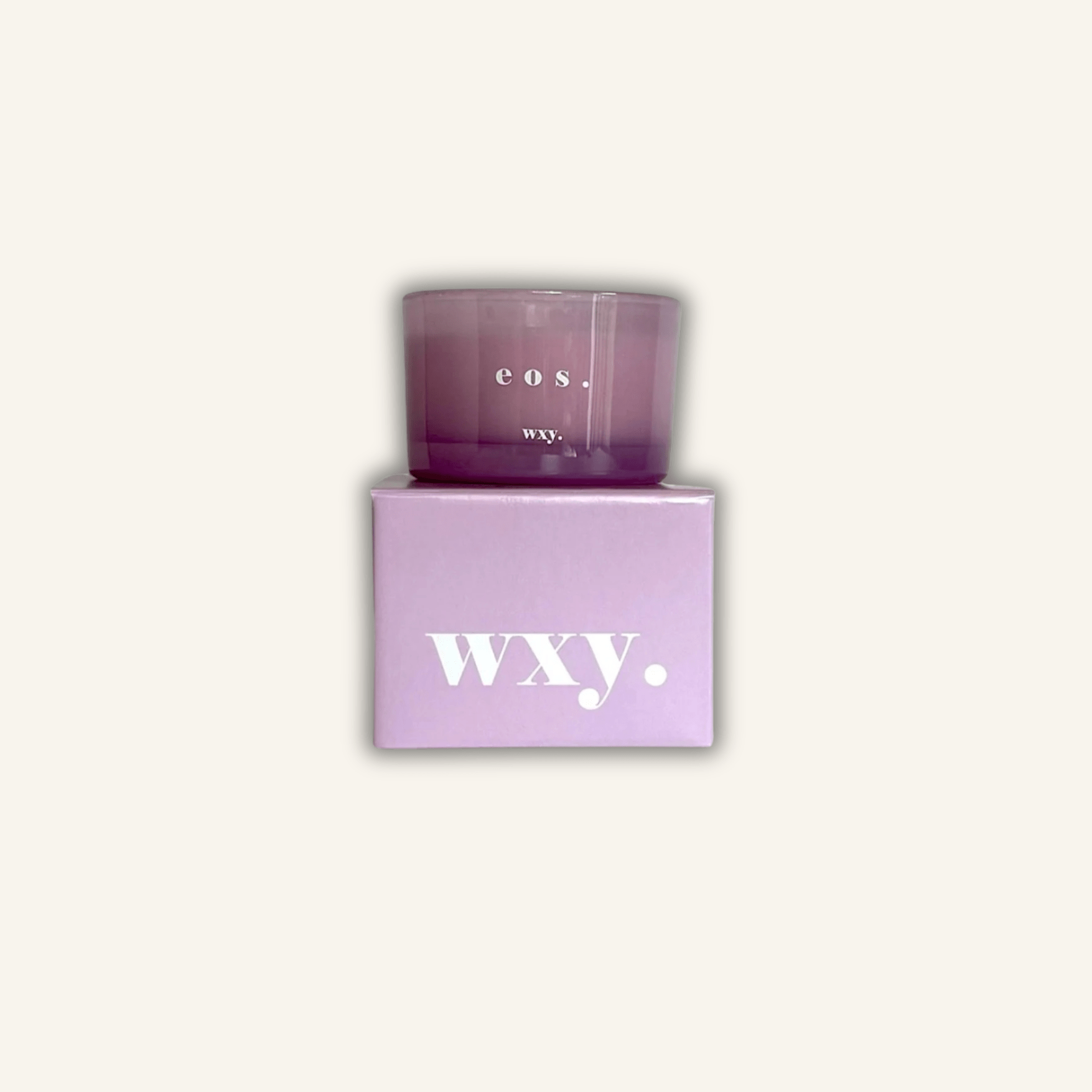 WXY DAWN scented candle with notes of jasmine, orris root, amber and lime.