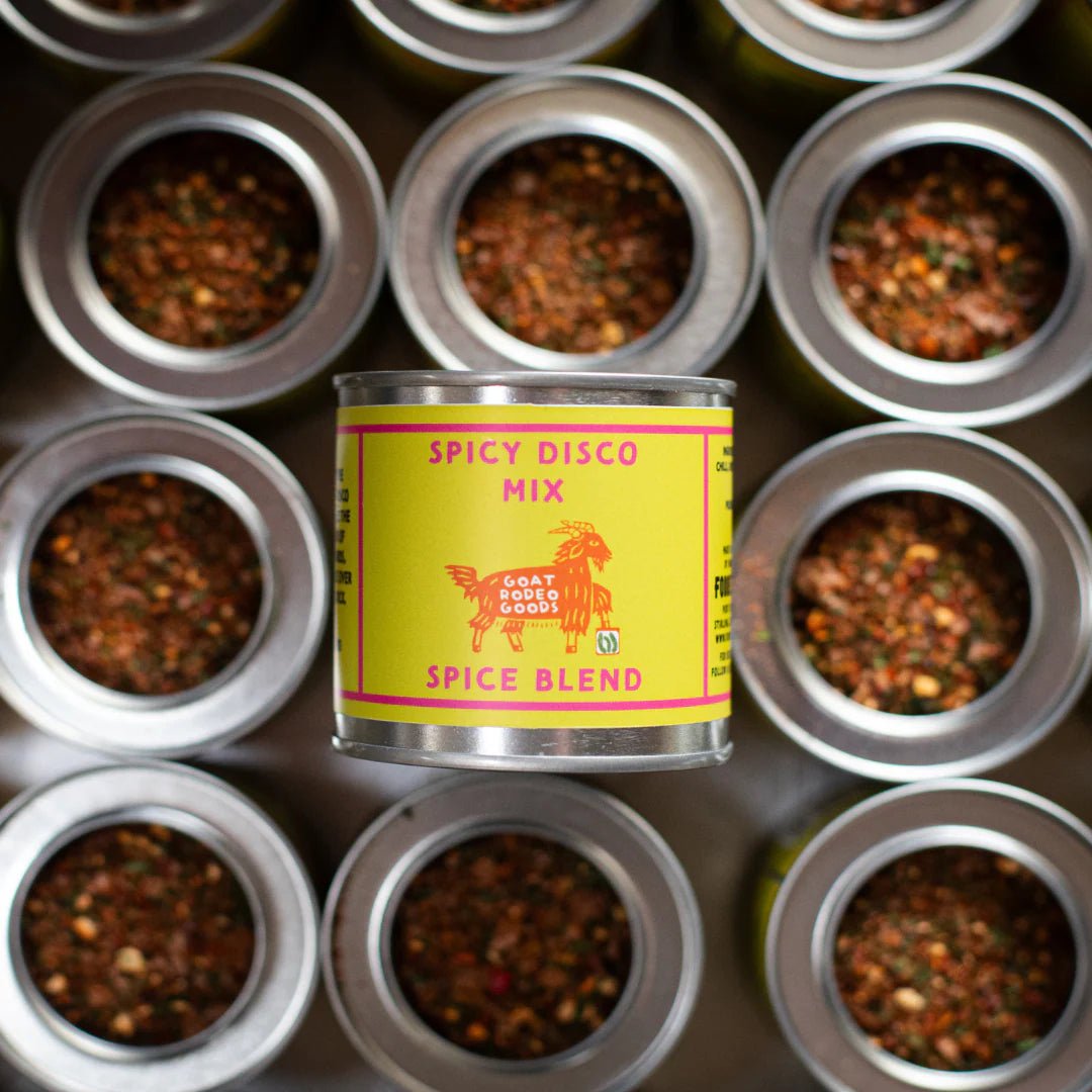 Can of 'Spicy Disco Mix' spice blend surrounded by small containers of spices.
